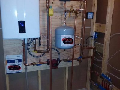 A home heating system with two boilers and pipes.
