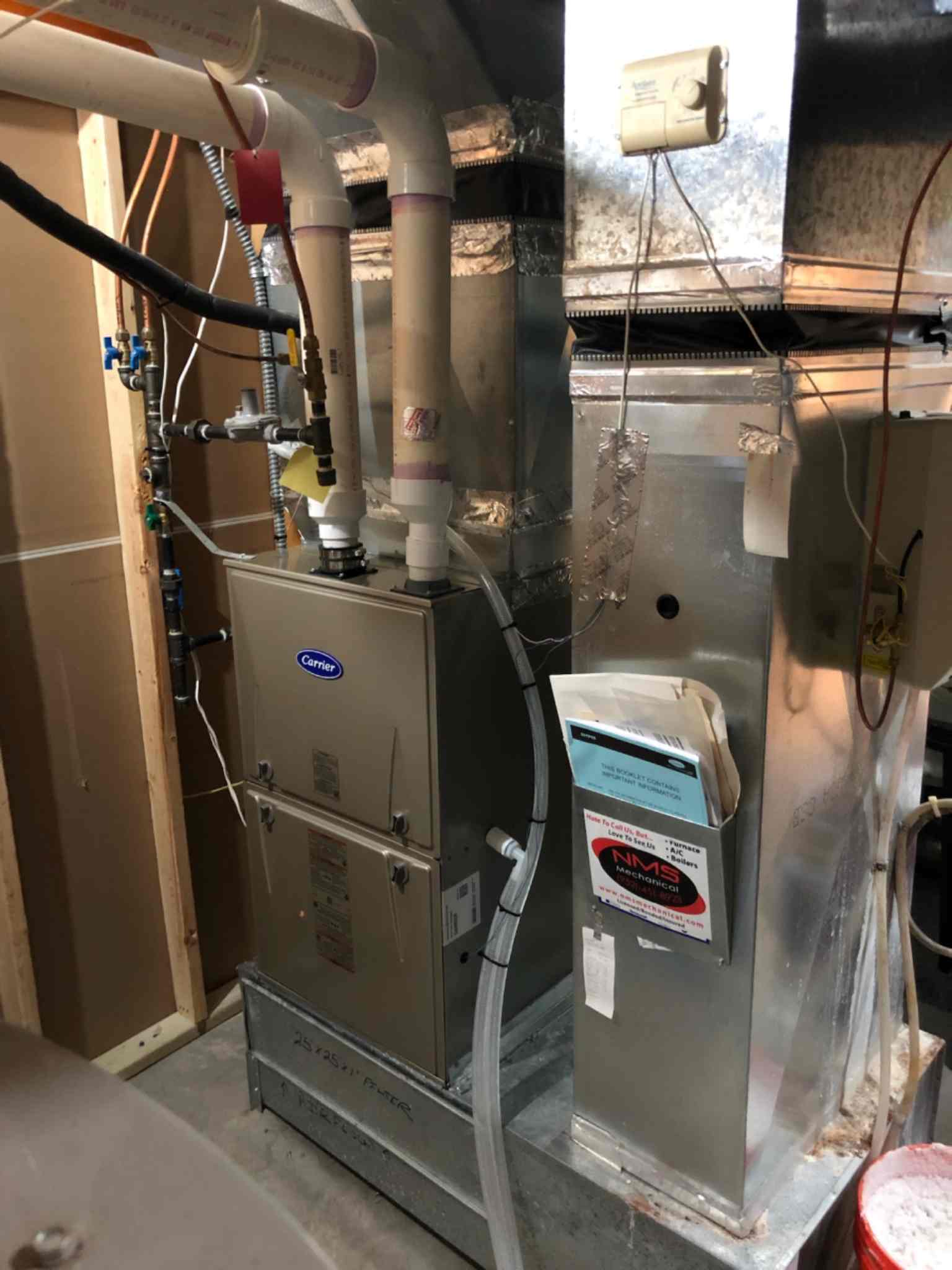 A gas furnace and air conditioner in a home.